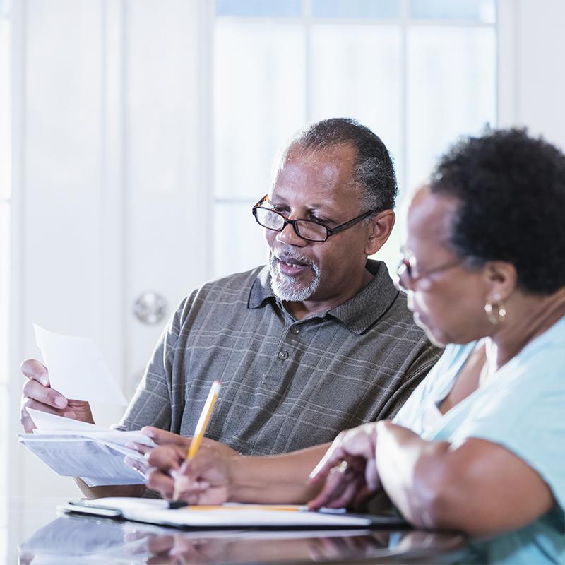 Older Black couple reviews paperwork