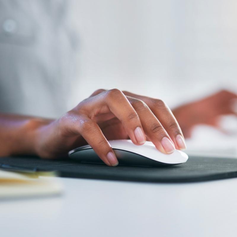 Hand on a computer mouse