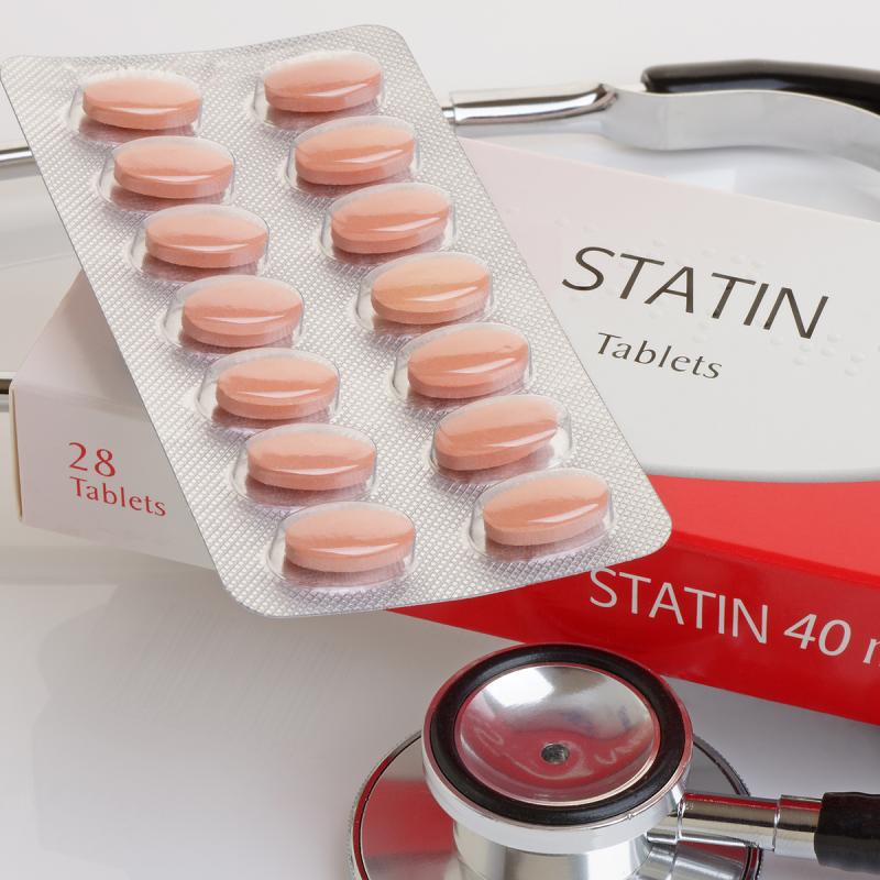 Statin tablets and a stethoscope
