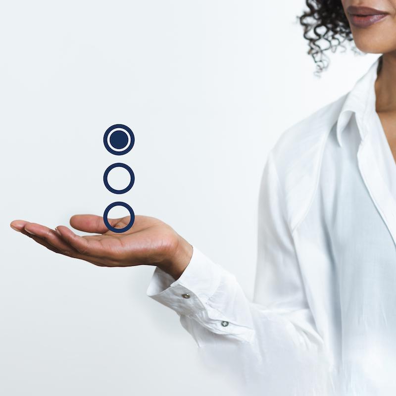 Doctor with three radio buttons hovering over her open palm. The first is selected